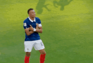 a soccer player wearing a blue jersey with the number 10