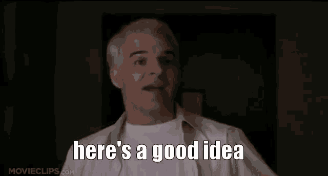 a man in a white shirt is saying `` here 's a good idea '' in a dark room .