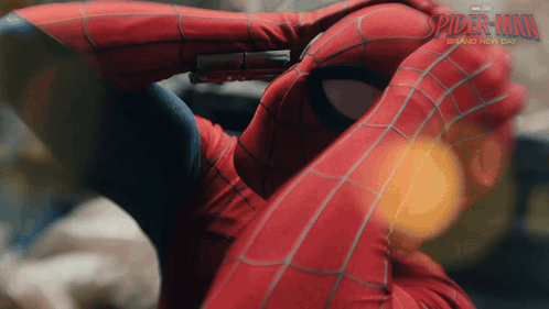a close up of a person in a spiderman costume