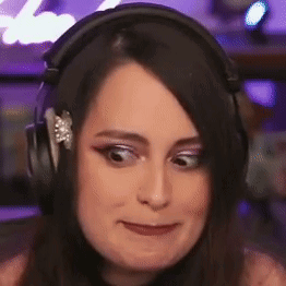 A woman shifts her eyes sideways with an uneasy expression.