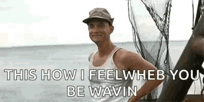 a man is standing on a boat in the ocean with his hands on his hips and a hat on .