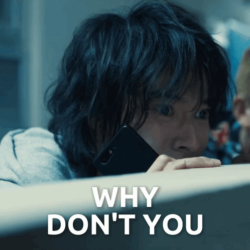 a person holding a cell phone with the words " why don 't you " below it