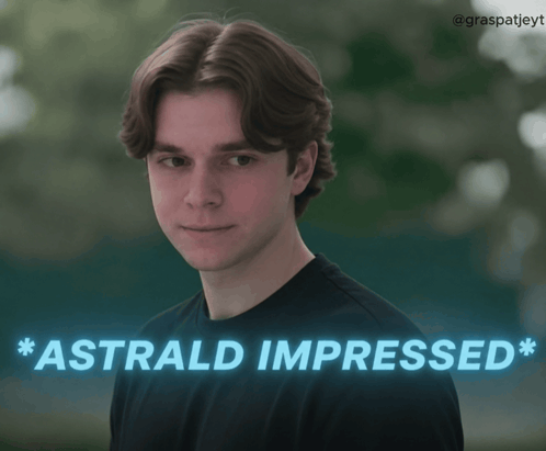 a young man in a black shirt with the words astral impressed behind him