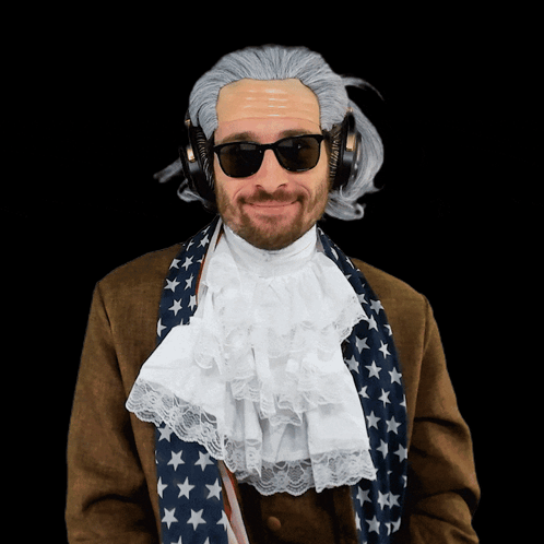 a man wearing a wig and sunglasses has headphones on