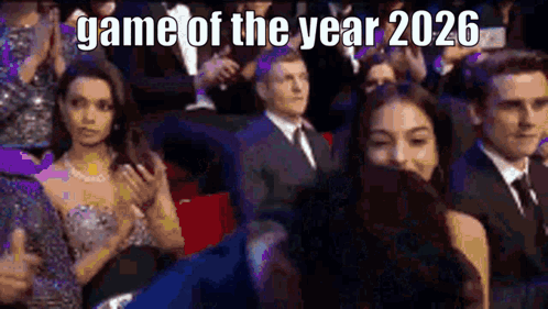 a group of people are sitting in a theatre watching a movie .