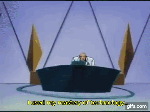 a man is sitting at a desk in front of a microphone and says i used my mastery of technology ..