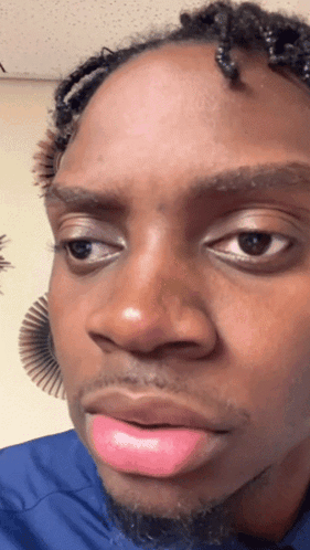 a close up of a person 's face with pink lipstick on
