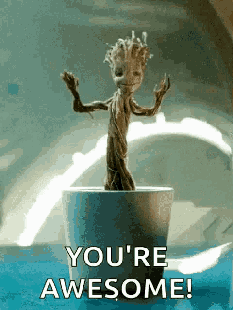 Baby Groot raises his arms with the caption “YOU’RE AWESOME!”