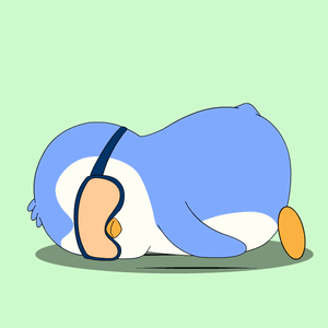 A blue penguin slumps asleep at a work desk.