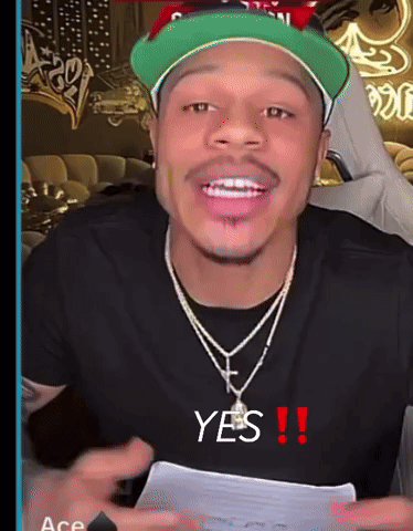 A man in a cap gestures to himself with “YES!!” text.