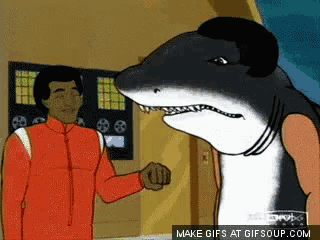 a cartoon of a man and a shark with the words make gifs at gifsoup.com below them