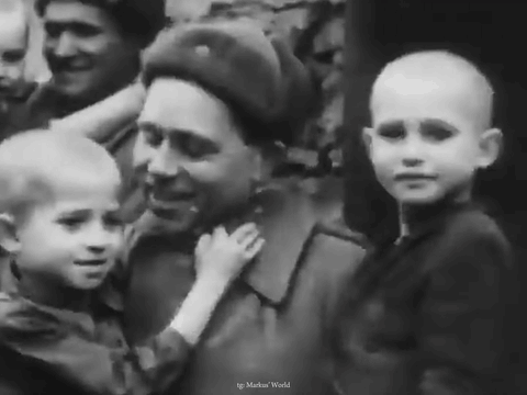 a black and white photo of a man holding a child