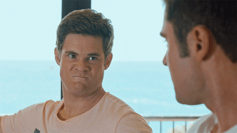 Two animated characters face each other with a serious reaction.