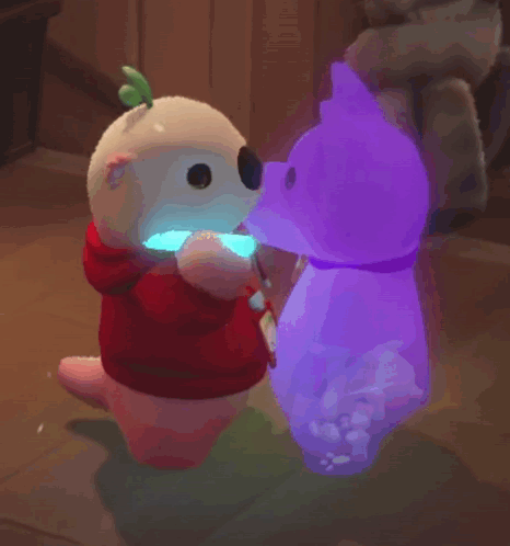 a stuffed animal with a red hoodie is holding a light stick