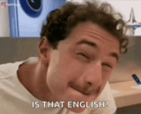 a man with curly hair is making a funny face and asking is that english