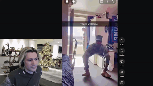 a man is standing in front of a christmas tree with a snapchat saying " you 're welcome "