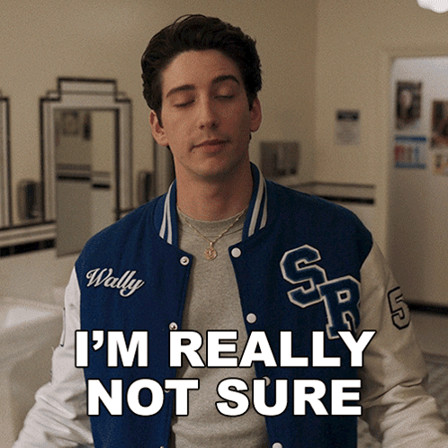 a man wearing a varsity jacket that says wally on it