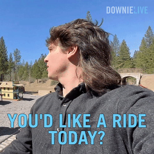 a man with a mullet is asking if he 'd like a ride today
