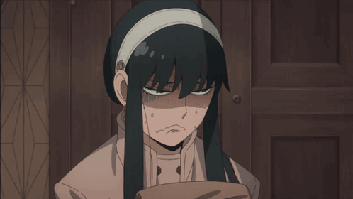 a girl with long black hair and a white headband is looking down
