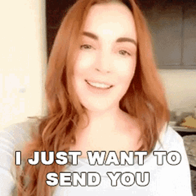 a woman with long red hair is smiling and says i just want to send you