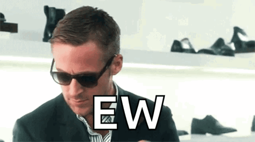 Ryan Gosling in sunglasses recoils beneath a large “EW” caption.