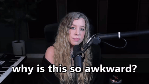 a woman sitting in front of a microphone with the words " why is this so awkward " above her