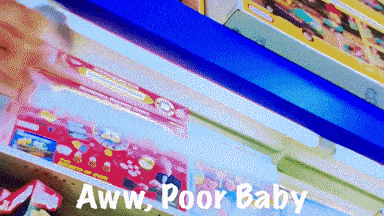 a shelf full of toys with the words aww poor baby written on the bottom