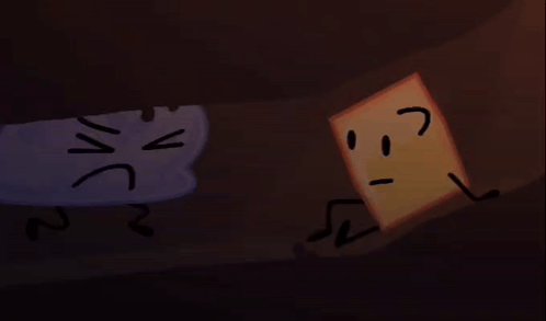 a cloud and a square are sitting next to each other in a dark cave