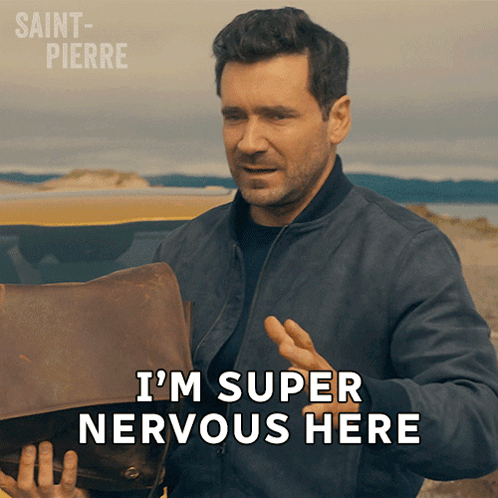 a man is holding a briefcase and says i 'm super nervous here