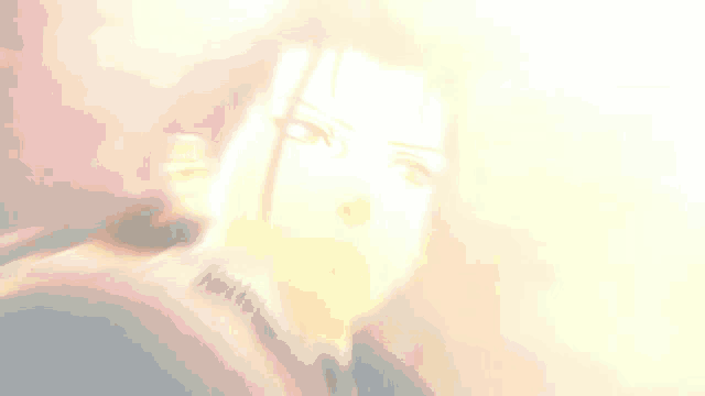a close up of a man 's face with long hair