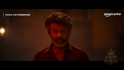a man with a beard is standing in front of a screen that says amazon prime