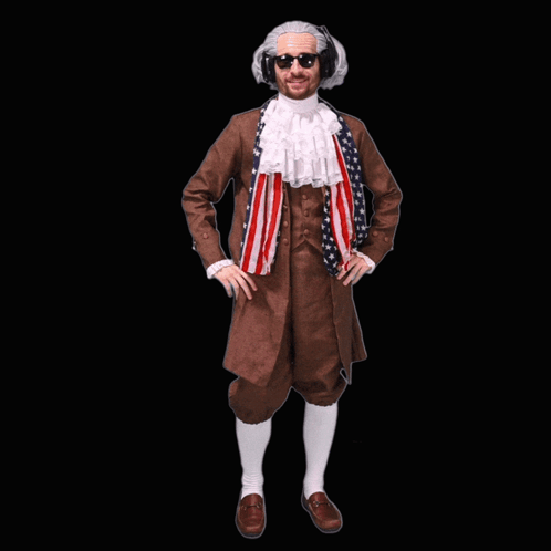 A costumed man stands against black in a theatrical farewell pose.