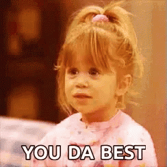 A young girl looks up with the caption “YOU DA BEST.”