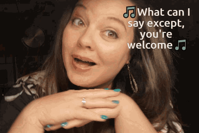 A woman sings or speaks along to “What can I say except, you’re welcome” text.