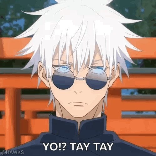 a man with white hair and sunglasses is standing in front of a red bench .