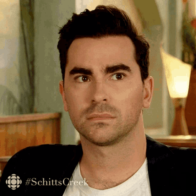 David Rose from Schitt's Creek gives a tense, bewildered stare.