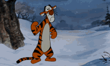 Tigger stands sadly in a snowy forest scene.