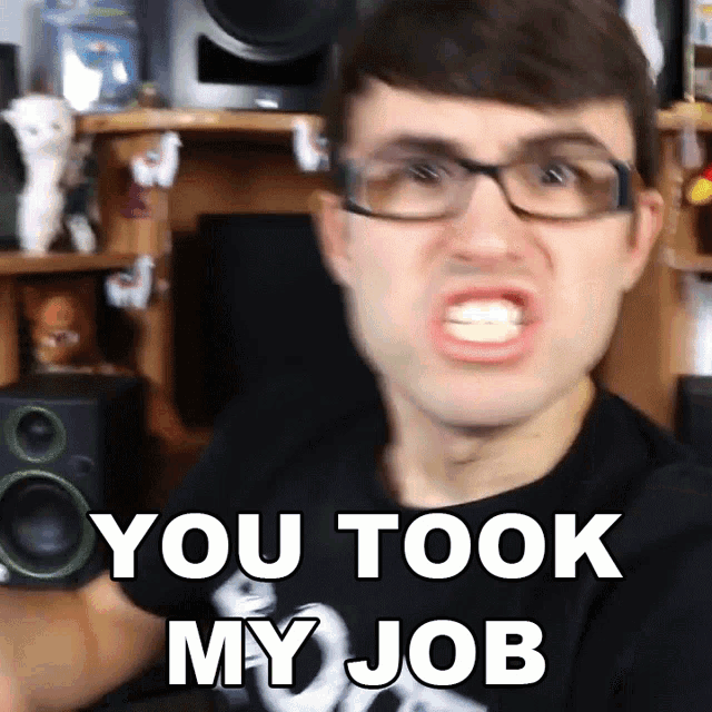 a man with glasses is making a funny face and says you took my job