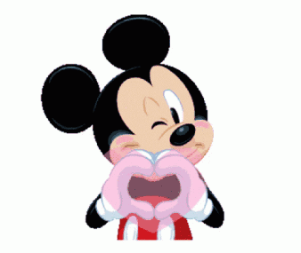 Minnie Mouse holds a large pink heart in front of her.