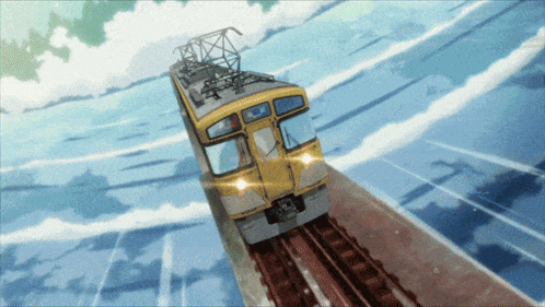 a yellow train is going down the tracks in a blue sky