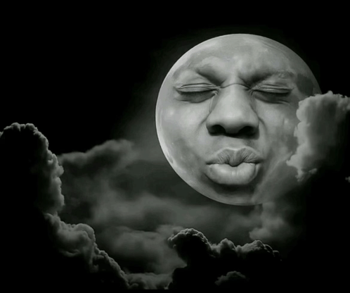 a full moon with a man 's face on it