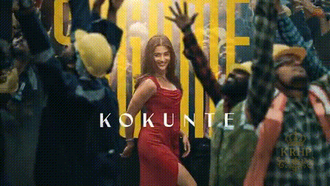 a woman in a red dress is dancing in front of a crowd of people with the word kokunte on the bottom .