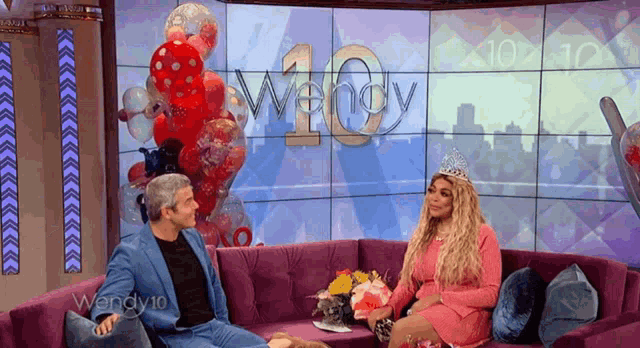 wendy 10 is shown on the screen behind the two people