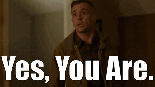 a man in a brown jacket says yes you are in white letters