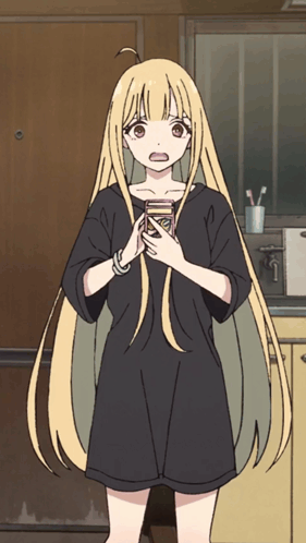 a girl with long blonde hair and a black shirt is holding a can