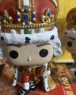 a funko pop figure of a king with a crown on his head