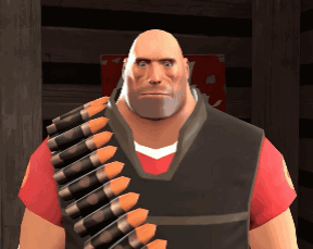a bald man with a beard is wearing a red shirt and carrying a belt of bullets