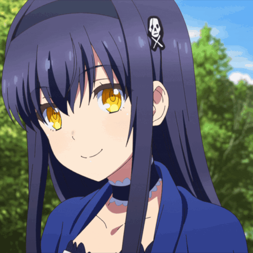 a girl with long dark hair has a skull and crossbones hair clip