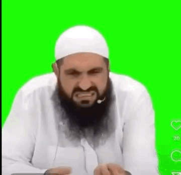 A bearded man in white clothing grimaces against a bright green background.