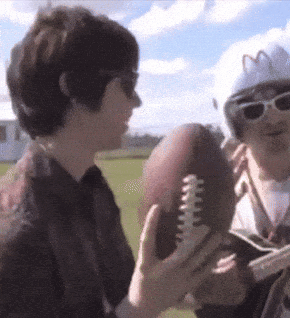 a man in a mcdonalds helmet holds a football